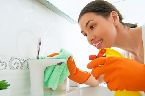 Technician treating a carpet stain during a cleaning service