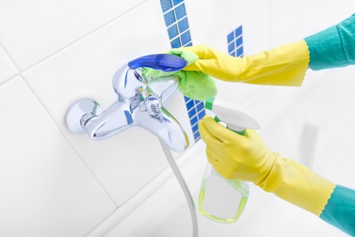 Local commercial cleaner working in a Kentishtown business premises hallway