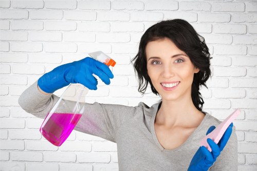 Office cleaner working in a Kentishtown workspace reception area